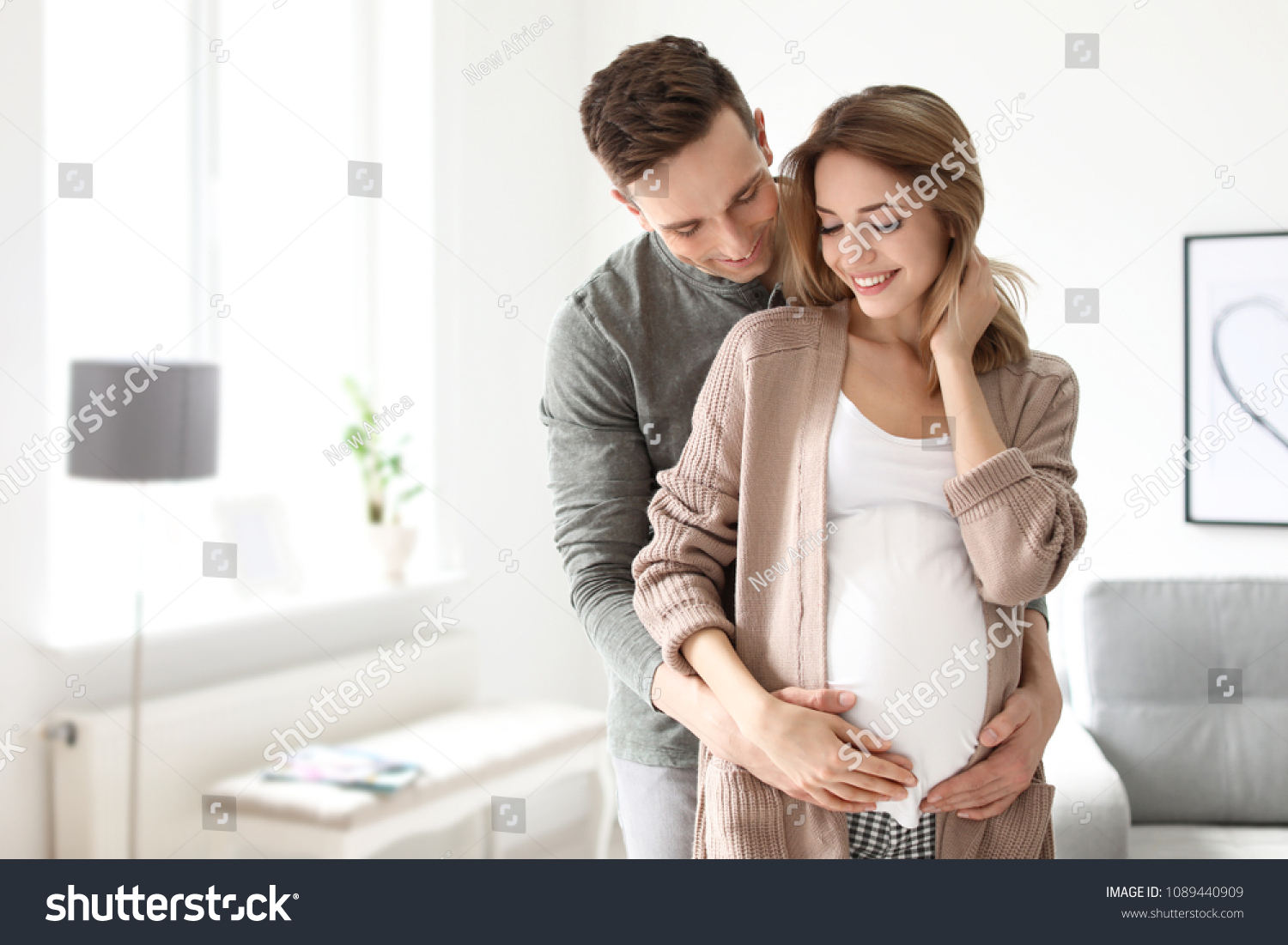 stock-photo-young-pregnant-woman-with-her-husband-at-home-1089440909 (1)